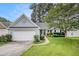 Charming single Gathering home with a well-manicured front yard and attached two-car garage at 104 Terrapin Ct, Carrollton, GA 30116