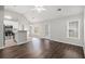 Open-concept space with wood flooring, vaulted ceilings, neutral walls, and a modern kitchen at 104 Terrapin Ct, Carrollton, GA 30116
