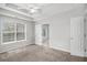 Comfortable Primary bedroom featuring a tray ceiling and en-suite bathroom access at 104 Terrapin Ct, Carrollton, GA 30116