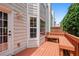 Relax on this spacious back deck featuring a built-in bench and outdoor lighting at 2061 Pinnacle Pointe Dr, Norcross, GA 30071