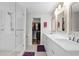 Modern bathroom features glass-enclosed shower, double vanity with marble counters, and walk-in closet at 2061 Pinnacle Pointe Dr, Norcross, GA 30071