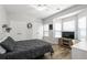 Cozy bedroom with large windows, modern decor, hard wood floors, and ample closet space at 2061 Pinnacle Pointe Dr, Norcross, GA 30071