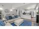 Open-concept living room and dining area featuring an adjacent modern kitchen at 2061 Pinnacle Pointe Dr, Norcross, GA 30071
