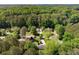 An aerial view of houses nestled among dense trees and greenery, creating a serene environment at 3519 Oak Knoll Dr, Marietta, GA 30068