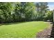 Expansive backyard featuring lush green grass and a patio area perfect for outdoor entertaining at 3519 Oak Knoll Dr, Marietta, GA 30068