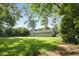 Sprawling backyard, showcasing the home's well-maintained lawn and mature trees at 3519 Oak Knoll Dr, Marietta, GA 30068
