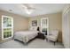 Comfortable bedroom with natural light, a ceiling fan, and a cozy chair at 3519 Oak Knoll Dr, Marietta, GA 30068