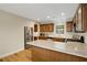 Spacious kitchen with stainless steel appliances, wooden cabinets, and modern lighting at 3519 Oak Knoll Dr, Marietta, GA 30068