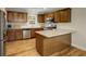 Kitchen featuring stainless steel appliances, wooden cabinets, and a breakfast bar at 3519 Oak Knoll Dr, Marietta, GA 30068