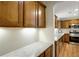Spacious kitchen with granite countertops, stainless appliances, and wooden cabinets with a connected eating area at 3519 Oak Knoll Dr, Marietta, GA 30068