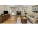 Bright living room with a fireplace, hardwood floors, neutral walls, and a comfortable seating area at 3519 Oak Knoll Dr, Marietta, GA 30068