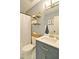 Bathroom features a toilet, shower with a white curtain, and a vanity with gold fixtures at 368 Lambeth Dr, Hiram, GA 30141