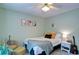 Bedroom features light green walls and bed with many decorative pillows at 368 Lambeth Dr, Hiram, GA 30141