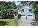 Charming two-story home with a well-manicured lawn, inviting curb appeal, and a two-car garage at 368 Lambeth Dr, Hiram, GA 30141