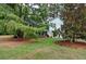 Home exterior with a well-maintained lawn, mature trees, and a welcoming entrance at 368 Lambeth Dr, Hiram, GA 30141