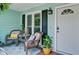 Cozy front porch featuring comfortable seating, plants, and a welcoming entrance, perfect for relaxation at 368 Lambeth Dr, Hiram, GA 30141