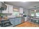 Updated kitchen features granite countertops, stainless steel appliances, and a breakfast nook at 368 Lambeth Dr, Hiram, GA 30141
