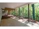 Covered outdoor patio with view of backyard and stairway to upper deck at 4166 Riverhill Ne Ct, Roswell, GA 30075