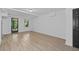 Finished basement space with new wood flooring and natural light from a window at 4166 Riverhill Ne Ct, Roswell, GA 30075