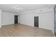 Bright basement room with wood floor and white walls, ready for customization at 4166 Riverhill Ne Ct, Roswell, GA 30075