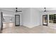 Bonus room with lots of windows and glass doors offering views of mature trees at 4166 Riverhill Ne Ct, Roswell, GA 30075