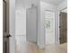 Hallway with laminate flooring connecting multiple rooms at 4166 Riverhill Ne Ct, Roswell, GA 30075