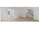 Spacious living room boasting abundant natural light, hardwood floors, and a seamless flow into adjacent spaces at 4166 Riverhill Ne Ct, Roswell, GA 30075