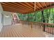 Spacious covered back porch offering scenic outdoor views of mature trees at 4402 Windsor Oaks Chase, Marietta, GA 30066