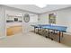 Spacious basement area featuring a ping pong table and open access to a kitchenette at 4402 Windsor Oaks Chase, Marietta, GA 30066