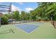 Outdoor basketball court features hoops and a well-maintained surface, surrounded by lush greenery and mature trees at 4402 Windsor Oaks Chase, Marietta, GA 30066