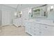 Large bathroom with double marble vanities, large mirrors, and tile flooring at 4402 Windsor Oaks Chase, Marietta, GA 30066