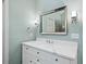 Bathroom features a marble vanity, large framed mirror, and sconce lighting at 4402 Windsor Oaks Chase, Marietta, GA 30066