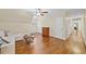 Bedroom with hardwood floors, ceiling fan, sofa couch, and connected hall at 4402 Windsor Oaks Chase, Marietta, GA 30066