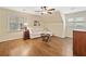 Bedroom with hardwood floors, ceiling fan, and sofa couch with a small coffee table at 4402 Windsor Oaks Chase, Marietta, GA 30066