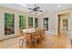 Well-lit dining room with wood floors, large windows, and access to the outdoors at 4402 Windsor Oaks Chase, Marietta, GA 30066