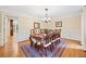 Formal dining room with wood table, hardwood floors and elegant chandelier at 4402 Windsor Oaks Chase, Marietta, GA 30066