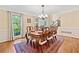 Elegant dining room featuring hardwood floors, chandelier, and natural light at 4402 Windsor Oaks Chase, Marietta, GA 30066