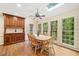 Bright dining area with hardwood floors, skylights, and large windows offering beautiful views of the surrounding landscape at 4402 Windsor Oaks Chase, Marietta, GA 30066
