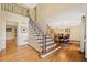 Foyer with staircase with wood and wrought iron detailing, and hardwood floors at 4402 Windsor Oaks Chase, Marietta, GA 30066