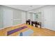 Home gym with cork flooring and workout equipment, with mirrors on the wall at 4402 Windsor Oaks Chase, Marietta, GA 30066