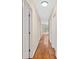 Hallway with hardwood floors and white doors leading to other rooms at 4402 Windsor Oaks Chase, Marietta, GA 30066