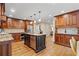 This spacious kitchen features custom cabinets, stainless steel appliances, and a center island perfect for entertaining at 4402 Windsor Oaks Chase, Marietta, GA 30066
