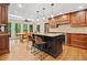 Sunlit kitchen with stainless steel appliances, granite countertops, center island, and breakfast nook at 4402 Windsor Oaks Chase, Marietta, GA 30066
