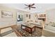 Bright living room with hardwood floors, fireplace, built-in shelves, and seamless flow to sunroom at 4402 Windsor Oaks Chase, Marietta, GA 30066