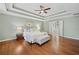 Spacious main bedroom with trey ceilings, fan, hardwood floors, and ensuite bathroom at 4402 Windsor Oaks Chase, Marietta, GA 30066