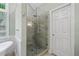Tile shower with glass door, dual shower heads, and adjacent soaking tub at 4402 Windsor Oaks Chase, Marietta, GA 30066