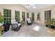 Bright sunroom with tile flooring, skylights, and lots of windows, creating a relaxing space to enjoy the view at 4402 Windsor Oaks Chase, Marietta, GA 30066