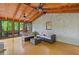 Comfortable sunroom with wood floors, and walls of windows offering beautiful views of the surrounding landscape at 4402 Windsor Oaks Chase, Marietta, GA 30066