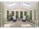Bright sunroom with tile flooring, skylights, and lots of windows, creating a relaxing space to enjoy the view at 4402 Windsor Oaks Chase, Marietta, GA 30066