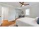 Spacious bedroom with hardwood floors, ceiling fan, and updated neutral decor at 2048 Mcafee Rd, Decatur, GA 30032